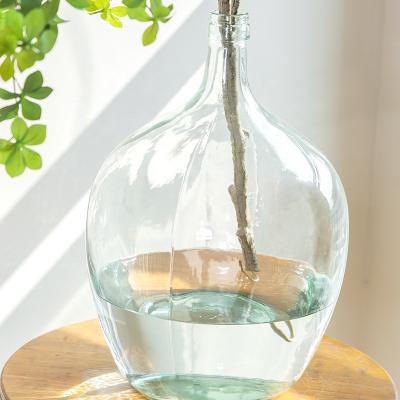 China Modern Clear Glass Vases Round Caliber Hot Selling Ornament Small Tall Bellied Water Bottle Vase Floor Standing Clear Glass Vase for sale