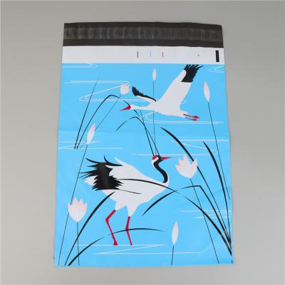 China Strong Adhesive Custom Small Mailing Poly Mailers Designed Blue Strong Plastic Bag With White Crane for sale