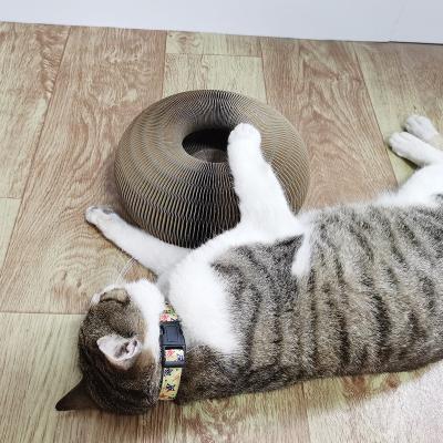 China Pet Paper Organ Cat Scratch Board With Rising Grinding Claw Corrugated Paper Scratcher Cat Scratch Toy Bell Ball Organ Living Room Bed for sale