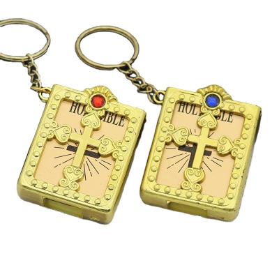 China Key Chain Accessories Mini English Inlaid Diamond Gold and Silver Engagement Book Key Chain Christian Jesus Cross Catholic Pendant for sale