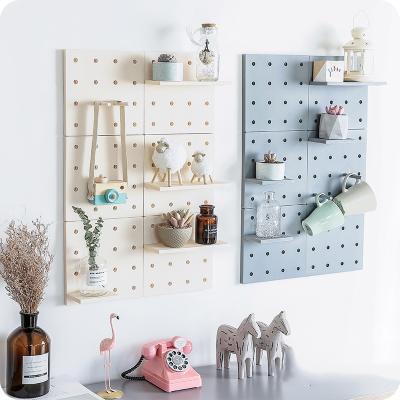 China Beautiful Grid Wall Shelf Hexagonal Combination Wall Hanging Geometric Figure For Nordic Wall Decoration Living Room Bedroom Rack for sale