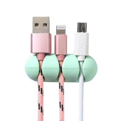 China Self-adhesive Silicone Stocked 2019 Desktop Cord Winder Collector Cable Holder Table Self Stick Headset Wire Wrap Holder Organizer for sale