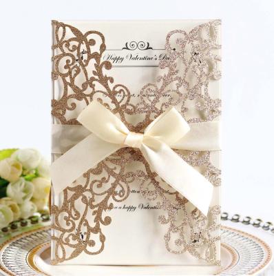 China Global Laser Cutting Luxury Shiny Elegant Rose Gold Wedding Cards Invitation Card With Ribbon for sale