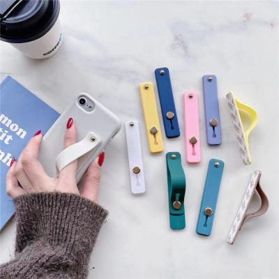 China Anti-fall Good Quality Wristband Strap Soft Silicon Phone Hand Band Holder For Smartphone for sale