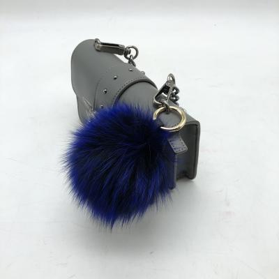 China Automatic Wholesale Natural Fur Pom Poms Large Instock Upholstery Puff Chain Ball As Bag Charm for sale