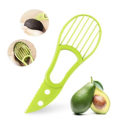 China Viable Green Multifunctional Avocado Peeler 3 in 1 Avocado Slicer Cutter with Grip Handle for sale