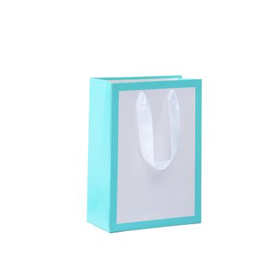 China White And Blue Recyclable Custom Logo Clothing Shopping Bag Packaging Gift Bag With Ribbon Handle For Cosmetics And Gift for sale