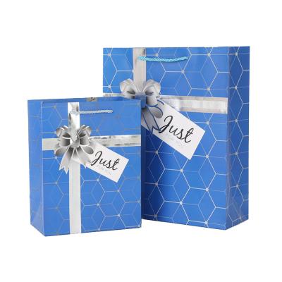 China Custom Reused Materials Logo Plaid Luxury Birthday Paper Packaging Gift Bags With Ribbon Handles for sale