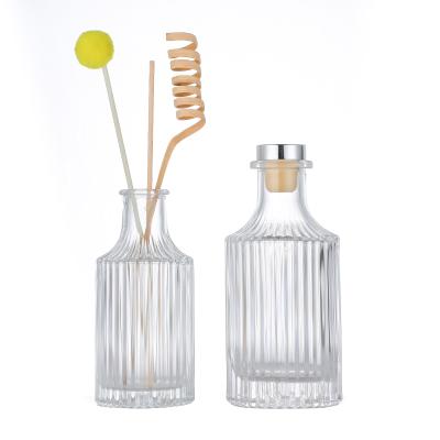 China Cosmetic Vertical Lines 150ml 250ml Round Glass Bottle Aromatherapy Aroma Reed Diffuser Bottle for sale