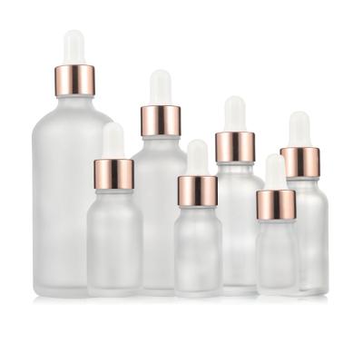 China Free Sample Cosmetic Dropper Bottle 3ml 5ml Clear Frosted Glass Dropper Bottle With Pink Aluminum Dropper for sale