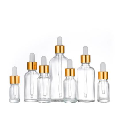 China 5ml 10ml 15ml 20ml 30ml 50ml 100ml Essential Oil Cosmetic Clear Bottle With Gold Alu Dropper for sale