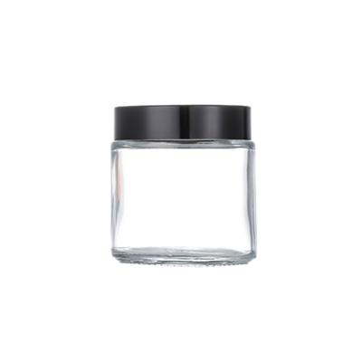 China Personal Care In Stock Empty Glass Cosmetic Container 100g Cream Jar With Black Lid for sale