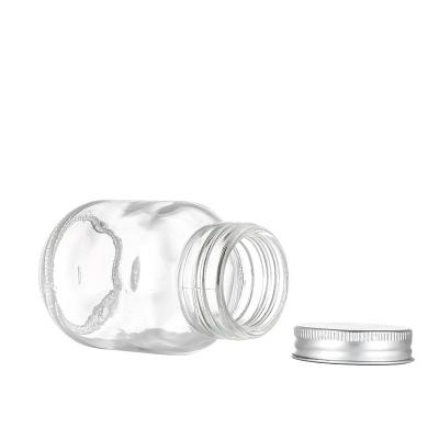 China Food Mini Empty Round Shape Glass Spice Shaker Bottles with Plastic Grinder for sale