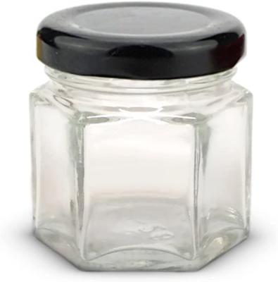 China Food Food Grade Hexagon Shaped Glass Jar Transparent Glass Honey Jar for sale