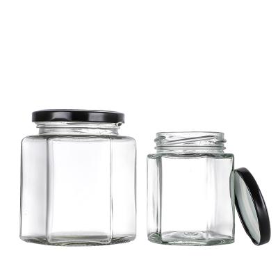 China Food Borosilicate Wide Mouth Sealed Hexagon Glass Honey Jar Container Jars With Steel Lids for sale