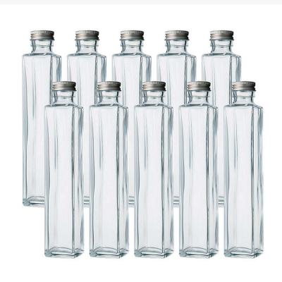 China Beverage 750ml clear empty liquor 750ml clear glass wine bottles for drinks with caps for sale