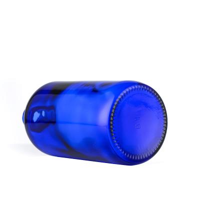 China Personal Care 500ml Blue Boston Round Glass Bottle With Black Fine-Mist Sprayer for sale