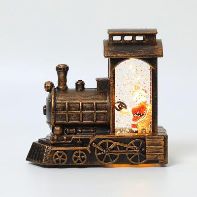 China Fashionable Train Christmas Lantern Battery Operated Lead Musical Resin Open Gift Home Decoration Waterproof Wind Light for sale