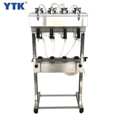 China Easy Operation Manufacturing Four Heads Semi Automatic Tiny Sample Oil Perfume Bottle Filling Machine for sale