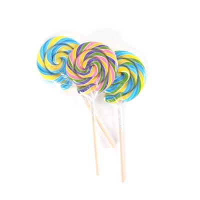 China Colored Handmade Rotating Confectionery Products 80g Halal Natural Soft Hard Candy Lollipop for sale