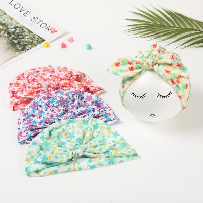 China Customized Wholesale Casual Floral Print Baby Bow Turban Baby Kids Turban Beanie Hat Knotted Headband Hot Sale Cute Baby Floral Turban for sale