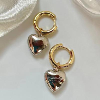 China TRENDY Gold Color Metal Heart Stud Earrings Unique Design Crystal Notched Love Heart Women Unusual Earrings New Fashion Jewelry for sale