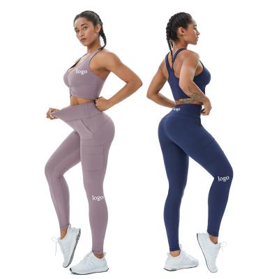 China Breathable Workout Clothes Sports Bra Yoga Gaiters With Pockets 2 Pieces Sets Fitness Women Sports Wear Gym Yoga Sets for sale