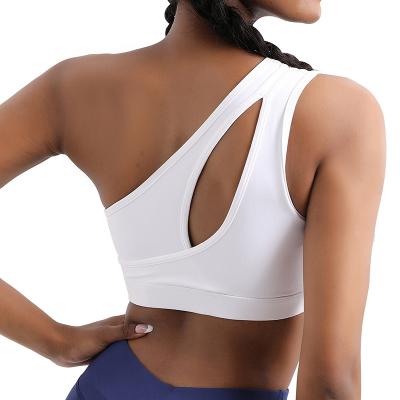 China Breathable Custom Logo High Quality Women Soft Compression One Shoulder Yoga Sports Bra With Removable Cups for sale