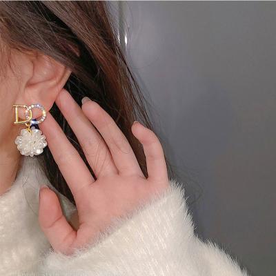 China 2021 new romantic silver S925 earrings light up luxury petal earrings design simple female niche pearl earrings for sale