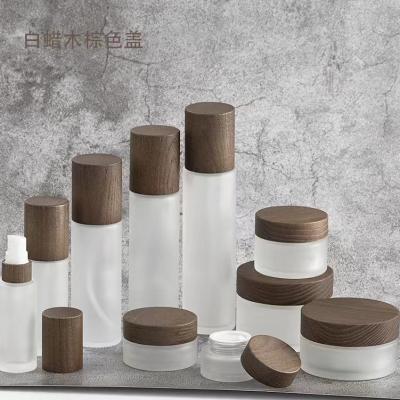 China Wholesale Matte Frosted  Clear  brown Bamboo Lid Jars And Glass Bottles For Cream Cosmetic for sale