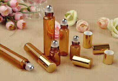 China empty amber galss  3ml 5ml  8ml 10ml 15ml cosmetic roll on stainless steel glass bottle with gold  cap for sale