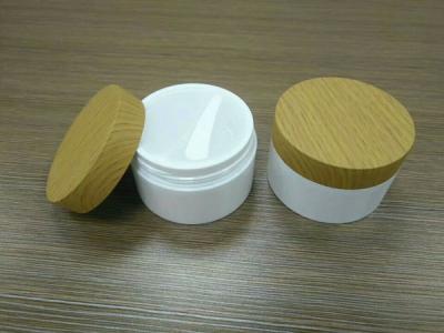 China Bamboo cap skincare body lotion cosmetic packaging 30g 50g 100g glass empty container frosted cream jars with lid for sale