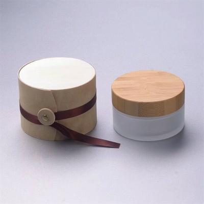 China 50g frosted glass cosmetic jars with bamboo lids facial cream container jars for sale