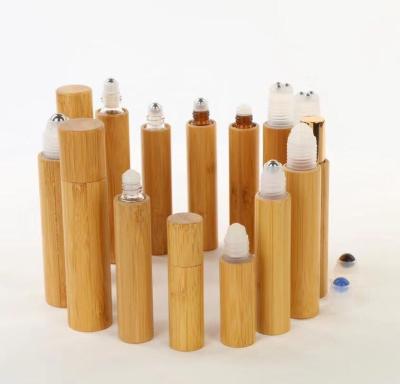 China New Products Engraving Logo 100% Organic Bamboo Cosmetic Packaging Bamboo Roll On Bottle Empty Glass Tube for  Perfume for sale