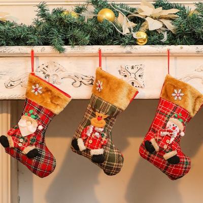 China 2022 Cute Christmas Stocking Candy Bag Santa Snowman Reindeer Patterns Christmas Gift Wholesale Plush Popular Plaid for sale