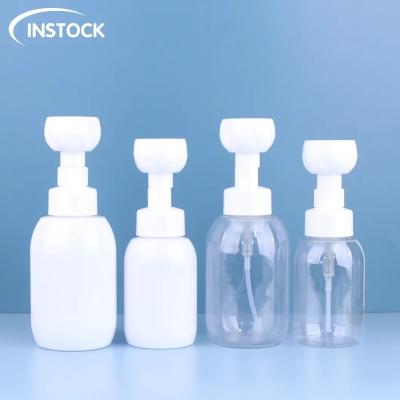 China Cosmetic Bottle 300/500ml Foam Bottle Soap Dispenser With Flower Shape Pump Facial Cleanser Hand Wash Bottle for sale