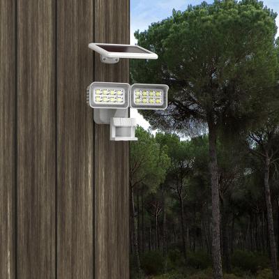 China Dual Adjustable Motion Sensor LED Sensor Energy Saving Outdoor Smart Sola Security Light Head Light for sale