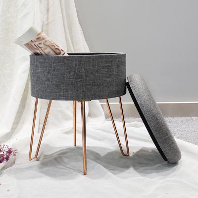 China Custom Modern Wholesale Colored Round Storage Seated Fabric Stool Gray Chair With Gold 4 Metal Leg for sale