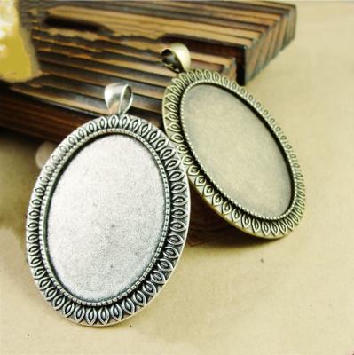 China Eco-Friendly Hot Selling Metal Flower Zinc Alloy Base Setting Oval Alloy Tray Bezel Pendant 30mmx40mm for sale