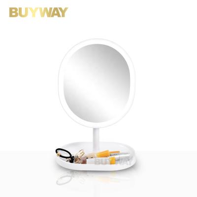 China Oval Lighted Shape Makeup Vanity Free Standing Desktop Cosmetic Led Shaving Mirror for sale