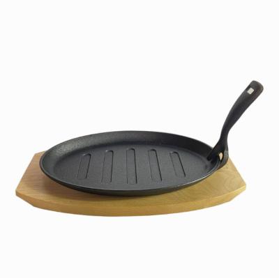 China Wholesale Viable Cast Iron Flat Bottom Plate Steak Sizzling Fish Frying Pan Fajita Pans Skillet With Wooden Dish for sale