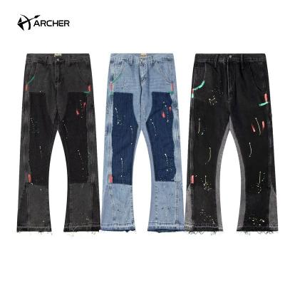 China Breathable Hiphop Patchwork Washed Cargo Hand Painted Jeans With Pockets Black Blue Rock Revival Jeans Designer Denim Flared Jeans Men for sale