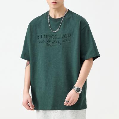 China Anti-wrinkle 100% cotton short sleeve with custom logo printed letter drop shoulder embossed t-shirt for men for sale