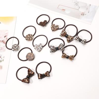 China Hair Decoration 2022 Summer Leopard Decoration Plastic Elastic Hair Bands For Girls for sale