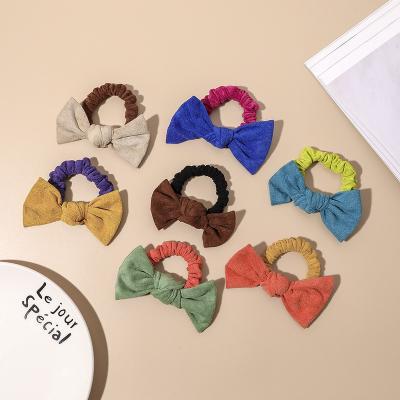 China Hair Decoration 2022 New Design Soft Faux Suede Leather Hair Bows Elastic Scrunchies Hair Ties For Girls for sale