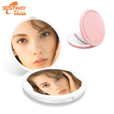 China Small Lighted Double Sided Portable Round Mini Travel Led Lighted Makeup Purse Pocket Handheld Magnifying Cosmetic Mirror for sale