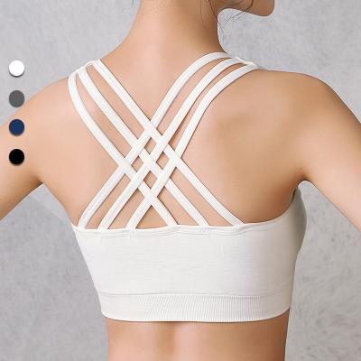 China Seamless Women Padded Sports Bras Designer Strappy Sexy Cross Back Sports Activewear Gym Tops Bra For Yoga Fitness Routine Wear for sale