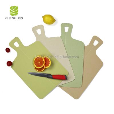 China Sustainable Unbreakable Environmental Protection Kitchen Wheat Straw Cutting Board Set Foldable for sale