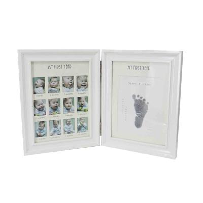 China Cheap Home White Newborn Gifts Bulk Deco Wooden Baby Photo Frame Folding 12 Months Baby Handprint and Footprint Mud MDF Photo Frame Kit for sale