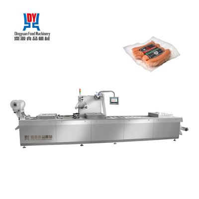 China Thermoformer stretch film food packaging machine for cooked instant food for sale